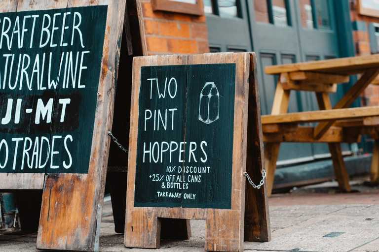 Sandwich board with drinks off on it